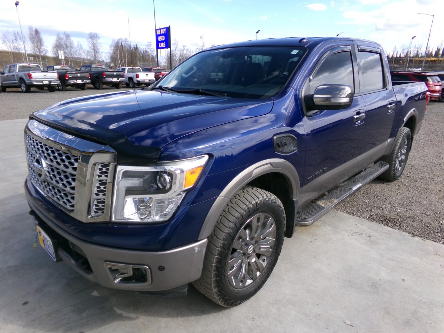 2017 /Black Nissan Titan Platinum Reserve Crew Cab 4WD (1N6AA1E52HN) with an 5.6L V8 DOHC 32V engine, 6A transmission, located at 2630 Philips Field Rd., Fairbanks, AK, 99709, (907) 458-0593, 64.848068, -147.780609 - Photo#0